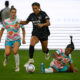 Kennedy Wesley and Trinity Rodman fight for the ball