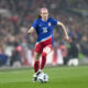 Rose Lavelle dribbles the ball with no defenders in sight.