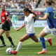 Alyssa Thompson controls the ball against Brazil defender Isa Haas.