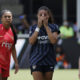 Trinity Rodman covers her mouth with both hands, reacting to her goal.