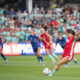 Lo'eau LaBonta winds up for a shot. Several North Carolina and Kansas City players trail her.